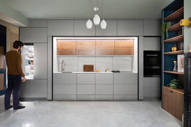 A Wall of Minimalist Cabinets Keeps This Kitchen Hidden Away